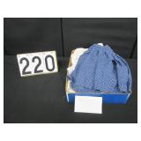 Box of larger doll clothes