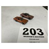 Two hot wheels redline series toy cars