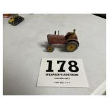 Early metal tractor Massey Harris, with farmer