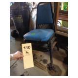 Four vinyl stack chairs