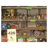 Three shelves: brass, copper valves/fittings