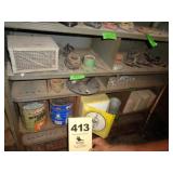 Four shelves: pipe fittings, hardware, fire brick