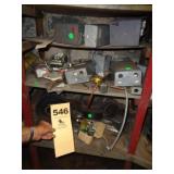 Four shelves: controls, boxes, pipe, unions