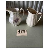 Two ceramic pitchers
