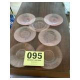 Seven pink depression, saucers, six match