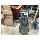 Vintage golf bag cart with one wooden handle iron