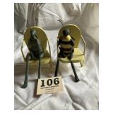 Two jointed bugs on metal chairs