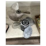 Two boat motor propellers