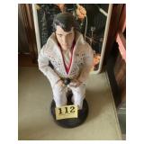 Elvis doll on stand