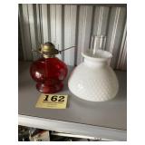 Red kerosene lamp with hob nail milk glass shade