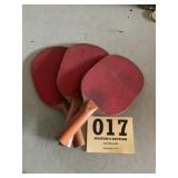Three vintage ping-pong paddles