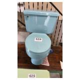 Blue American standard mid-century, modern toilet