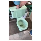 Mid-century, modern mint green toilet (cracked)