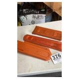 Three Stihl chainsaw covers