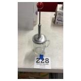 Red handle measuring cup chopper