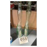 Set of tall Coca Cola bottles