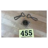 Two vintage Coca-Cola bottle openers and an