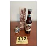 Vintage traveling items, alarm clockand a Schlitz