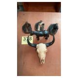 Cast iron horse and wall horses and skull