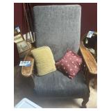 Large ornate wooden chair with cushions and