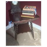 End table with claw feet and sculpted edges,