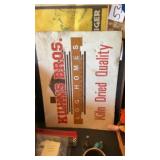 Kahnï¿½s brothers, log homes Inc. metal sign