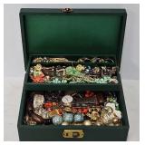 Green Jewelry Box Filled with Jewelry and Watches