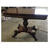 EARLY CARVED BASE TILT TOP GAME TABLE