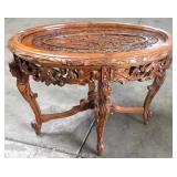 HEAVILY CARVED OVAL TABLE