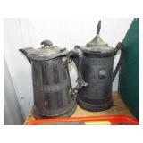 2 EARLY WATER TANKARDS