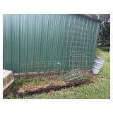 tomato cages, fencing, dog house (crack in roof)