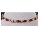 14K YELLOW GOLD LADIES BRACELET W/ GARNET STONES