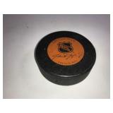 A Collection of Four Autographed NHL Hockey Pucks