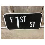East 1st St Sign