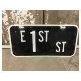 East 1st St Sign