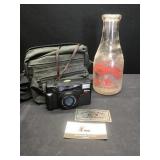Nikon & Milk Bottle