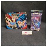 Tin of Pokemon cards, Hidden Moon,  Halos and more