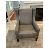 Gray leather wing back chair