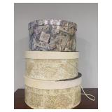 3 empty hat boxes