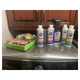 Zap cleaners, candles, a metal buckets