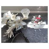 Perfume, mirror, vase, and flowers