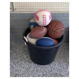 Rope tub full of miscellaneous sports equipment
