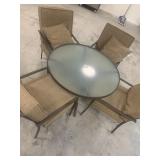 Glass top patio table with 4 chairs