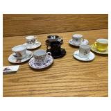 Eight demitasse cups and saucers