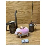 Oil cans and piggy bank