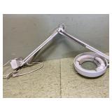 Articulating light and magnifying glass