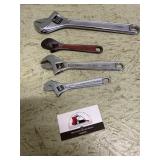 Adjustable wrenches