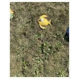 Metal yard art on a stick