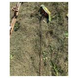 Metal yard art on a stick