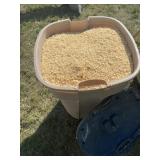 Garbage can full of animal bedding